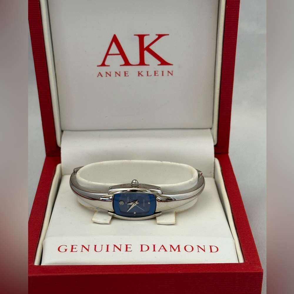 Anne Klein silver tone watch with blue face and genuine diamond
